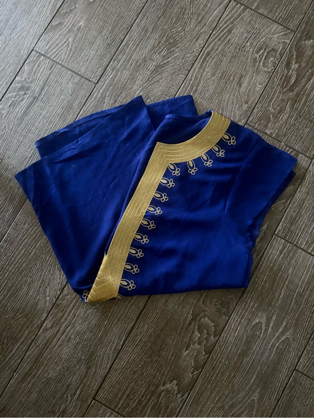 Royal blue sleeveless light weight v-neck top with embroidered gold trim